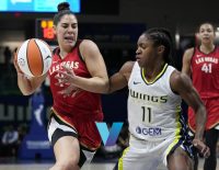 Kelsey Plum drives to the rim in their matchup against the Dallas Wings.